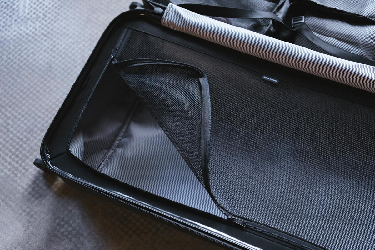 The inside of the Highland Luggage Carry-On with the zippered mesh section.